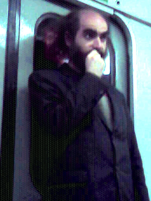 Man biting nail in Metro