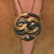 Necklace with a gold and a silver serpent biting each other's tails
