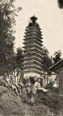 Old photograph of a Chinese family below a 14-storey pagoda